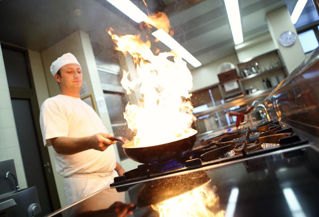 Hotel Premier Aqua - Adults Only Vrdnik Ngoại thất bức ảnh A chef cooking with a wok